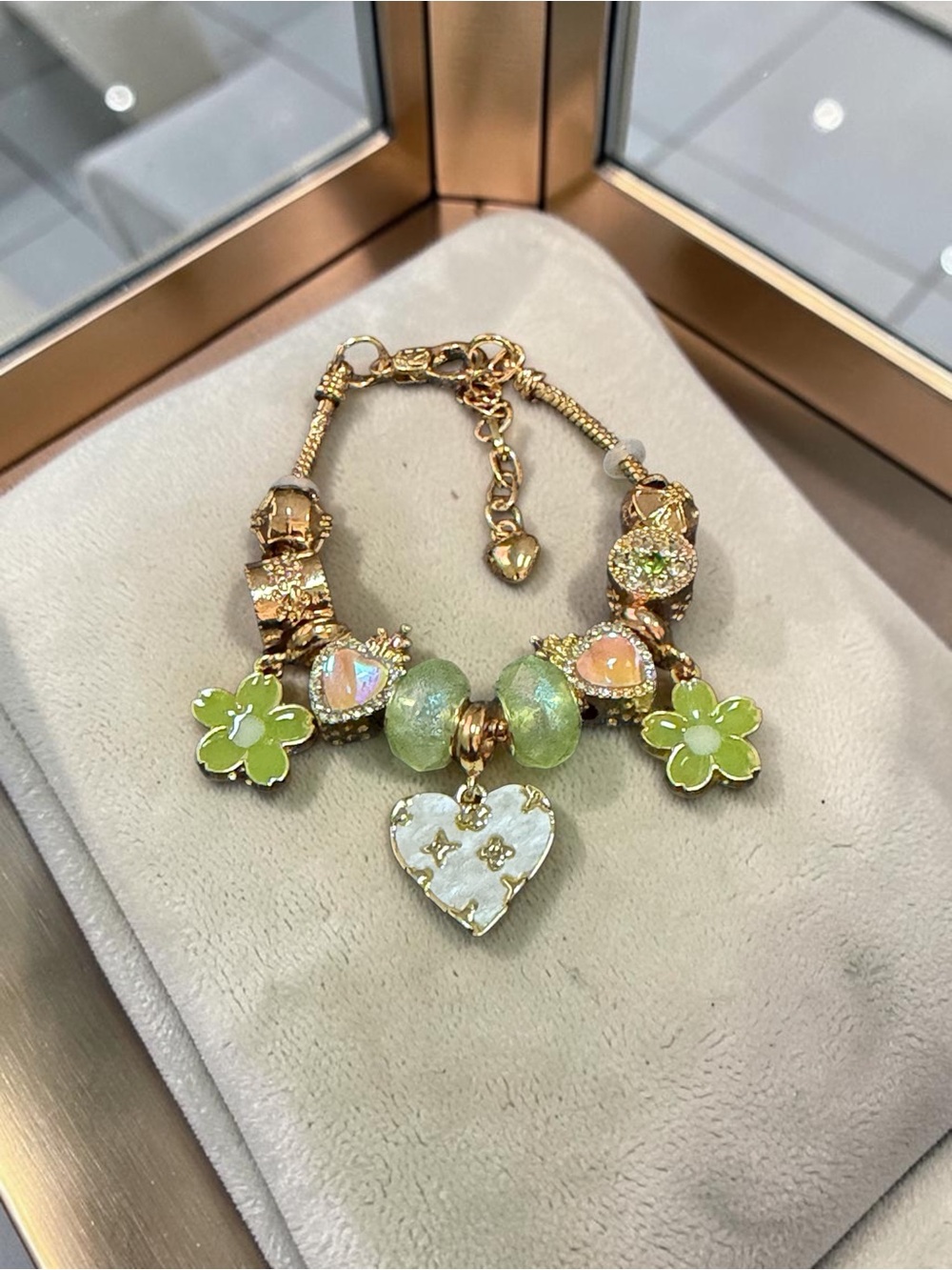 Gold Charm Bracelet with Green Enamel Flowers and Iridescent Heart Pendant